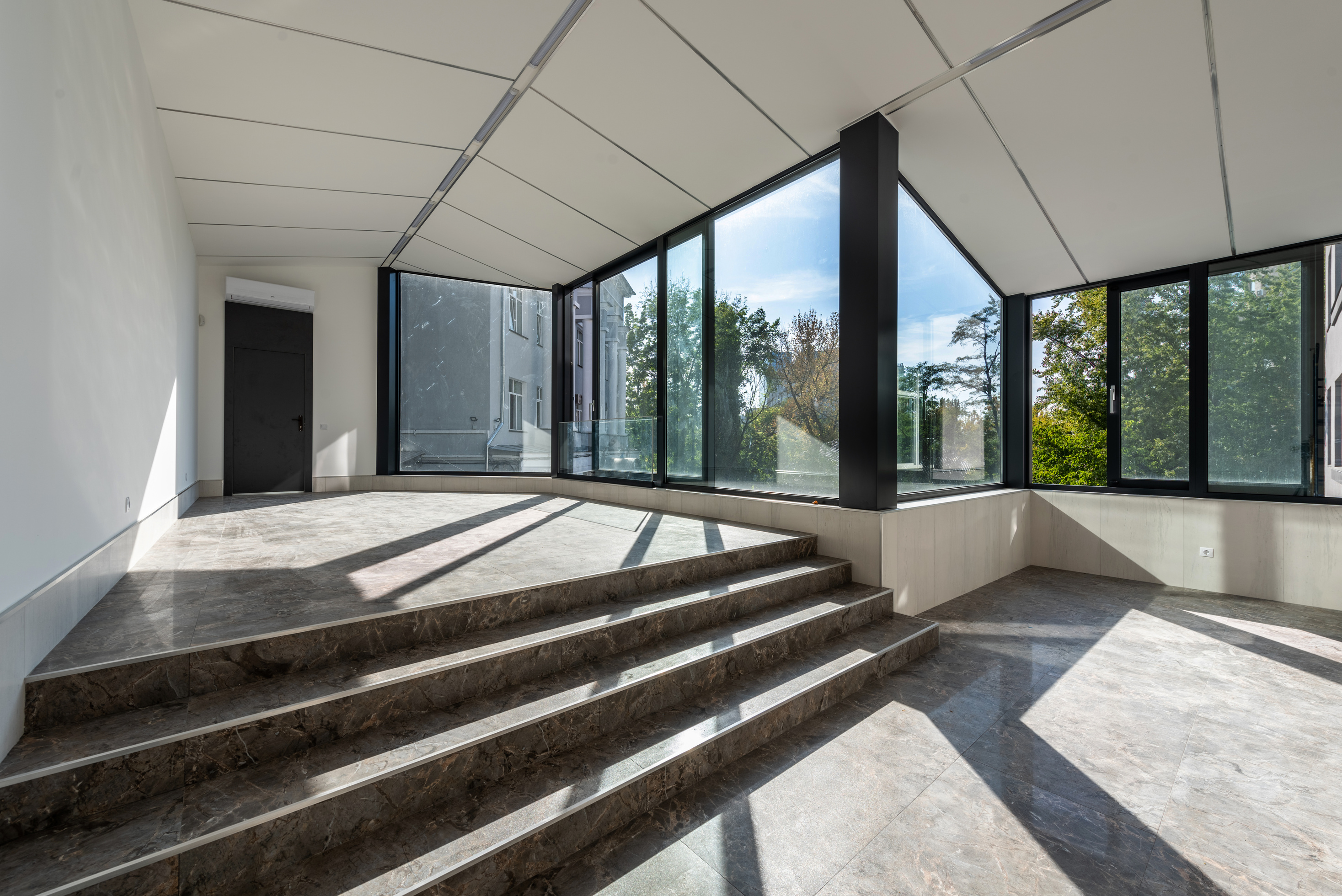 Room with Brown Tiled Floor and Glass Window